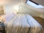 Loft bedroom with skylight